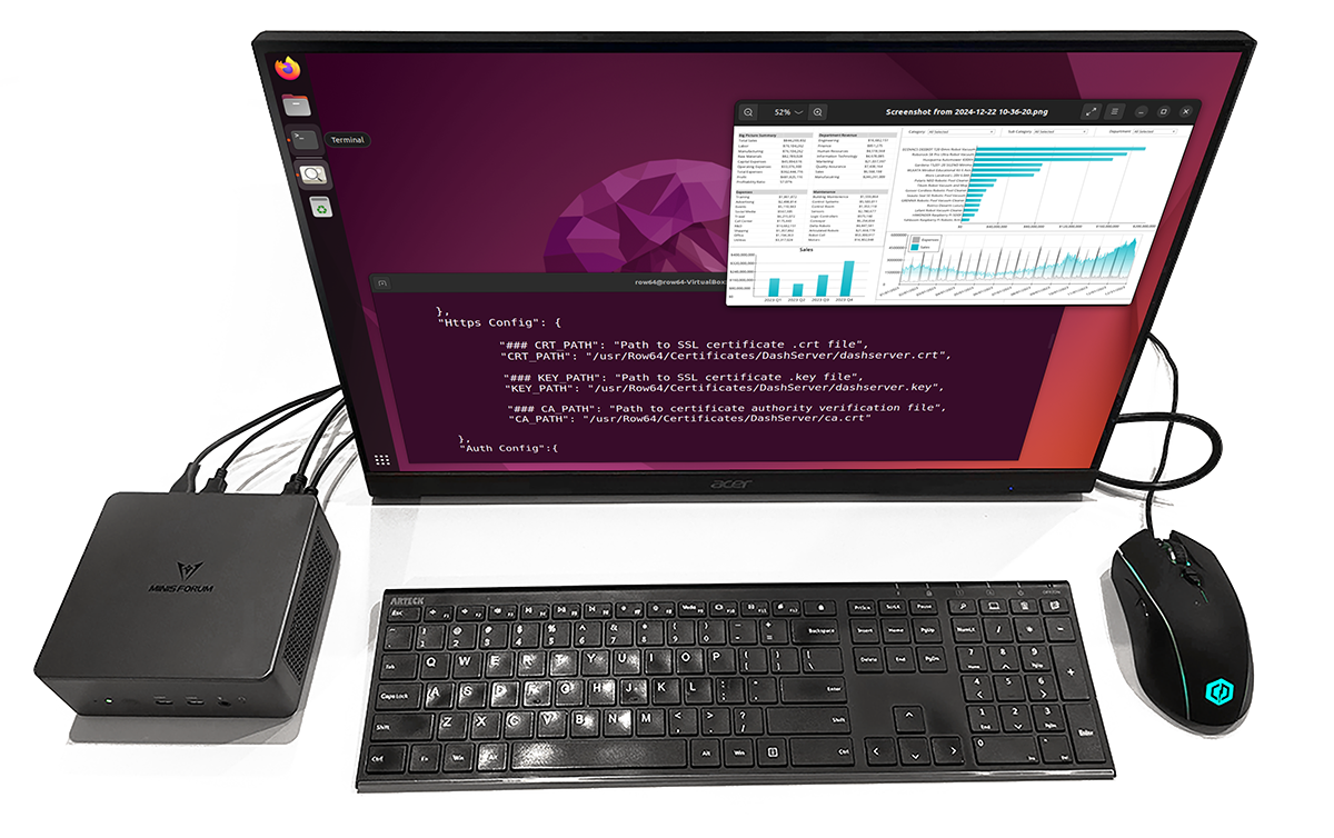 A black computer keyboard with a monitor in front of it.